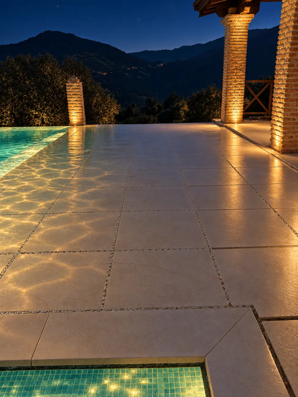 La misma terraza de noche con la iluminación subacuática encendida (recreación digital)